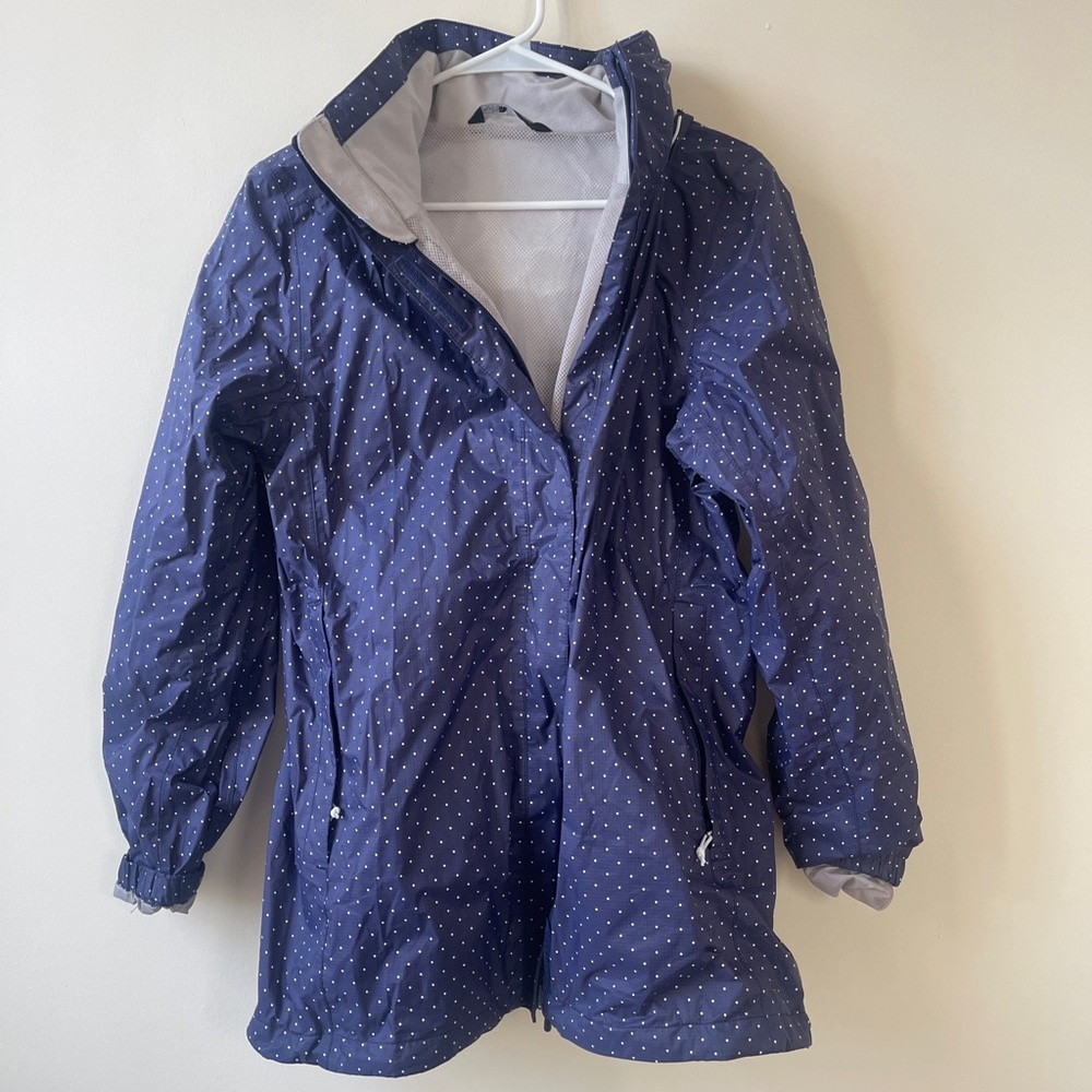 The North Face blue and white polka dotted rain jacket, size large